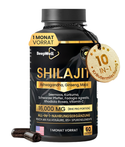 A black supplement bottle labeled BeepWell Shilajit, shown on a white background with two dark capsules in front and a hanging wooden badge reading '10 in 1'. The bottle label is predominantly black with gold and white text and accents.